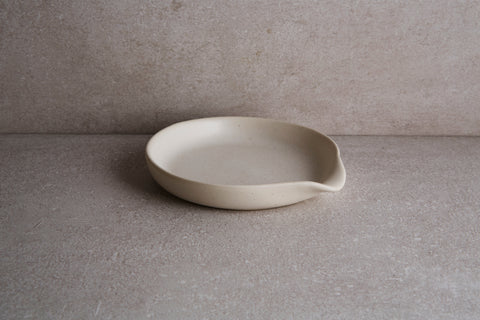 a white bowl on a counter